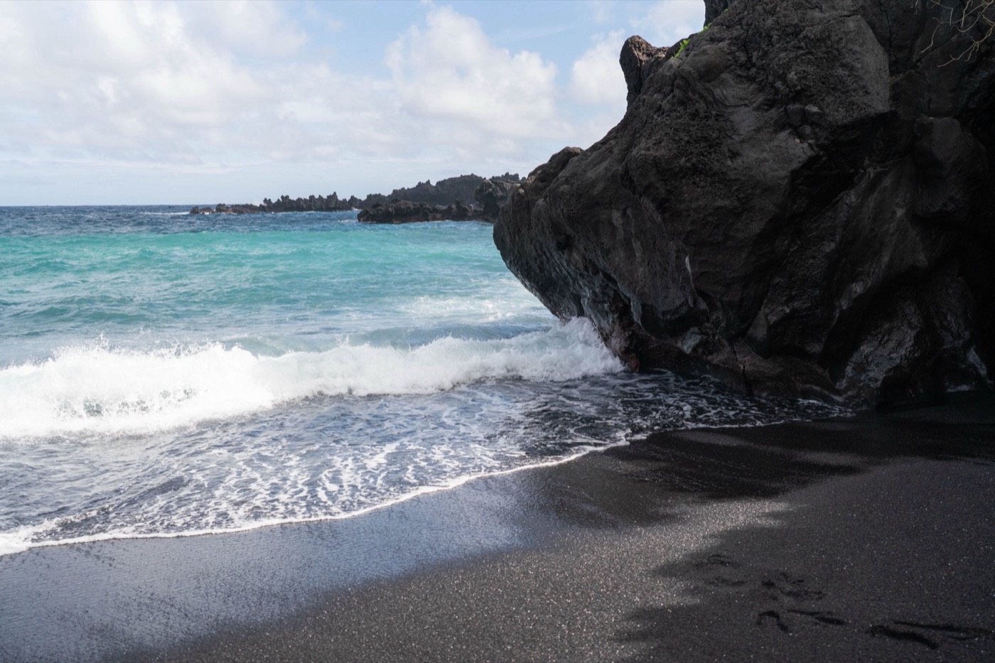 Black sand beach and volcanic rock, Maui, Hawaii metal print